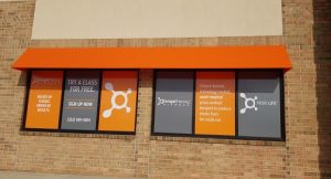 Orange theory window decal project adds life to their facility